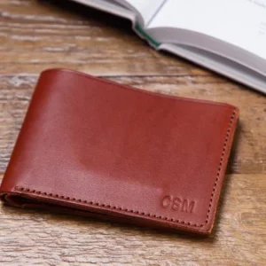 Portefeuille à deux volets en cuir monogrammé